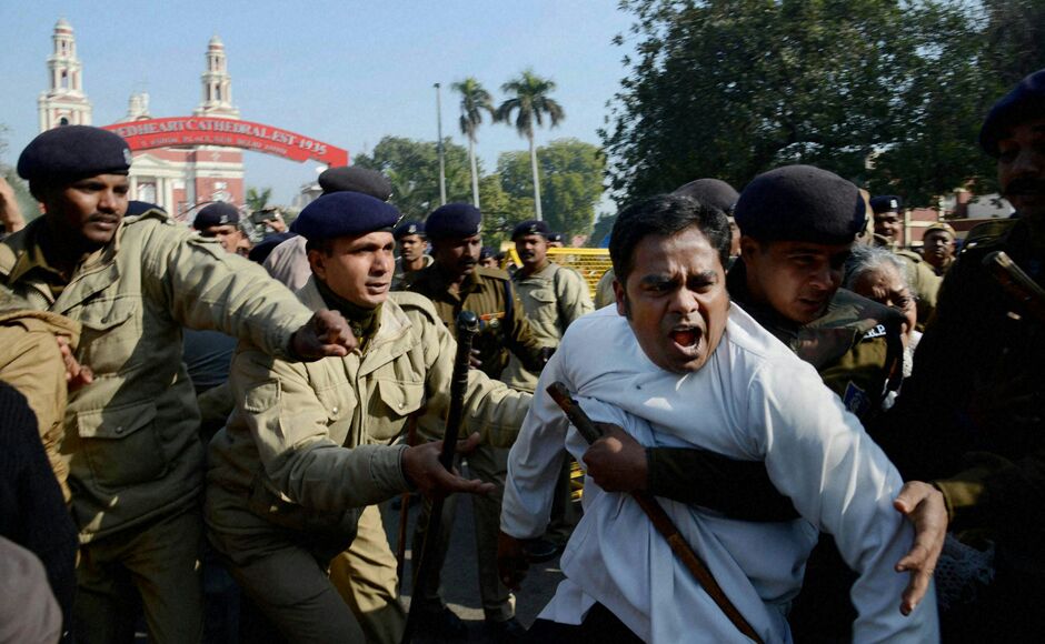 India,New Deli 05.02.2015Father Denny George being dragged by police in front of the Sacred Heart Cathderal in New Dehli when he attempted to join a demonstration Feb. 5 against the desecration and attacks on five Catholic churches in the Indian capital as well as months of Hindu harassment of Christians throughout the country.)Three policemen tried to drag me away. But I resisted. Then half a dozen of them lifted me upwith one even choking me by the neckand put me in the police bus. His priestly garb gave Father Dennis George little protection, he told international Catholic charity Aid to the Church in Need March 5.